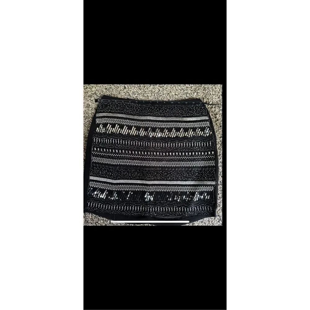 H&M sexy flirty, lightweight black mini with sequins and beads has a slip lining